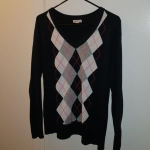 Black sweater with grey argyle print.